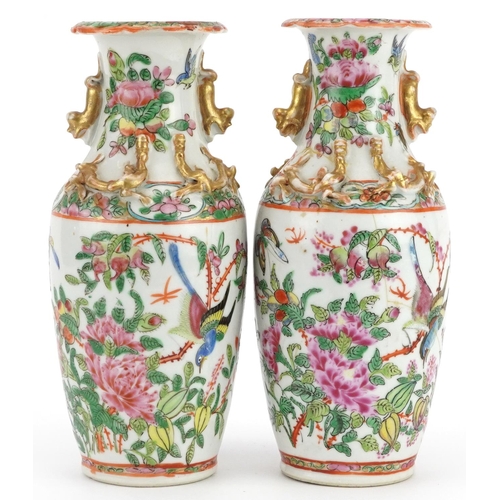 23 - Pair of Chinese Canton porcelain vases decorated in relief with dragons, each hand painted in the fa... 