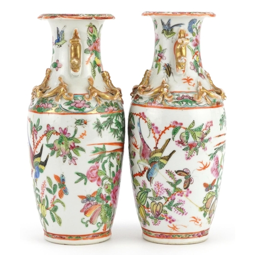 23 - Pair of Chinese Canton porcelain vases decorated in relief with dragons, each hand painted in the fa... 