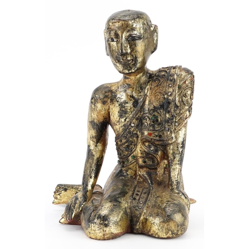 221 - Thai gilt carved wood seated figure of a robed monk, 31cm high