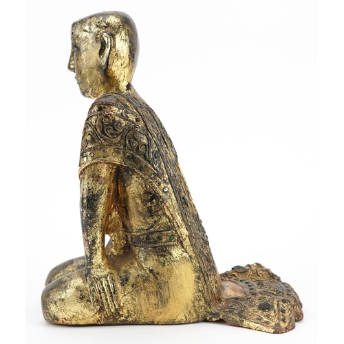 221 - Thai gilt carved wood seated figure of a robed monk, 31cm high