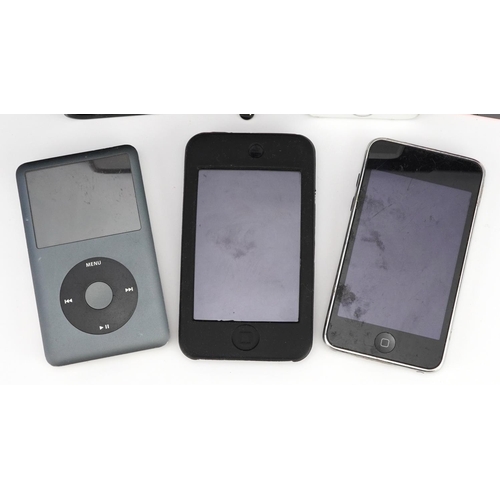 862 - Five iPhone mobile phones, one with box, and two iPods