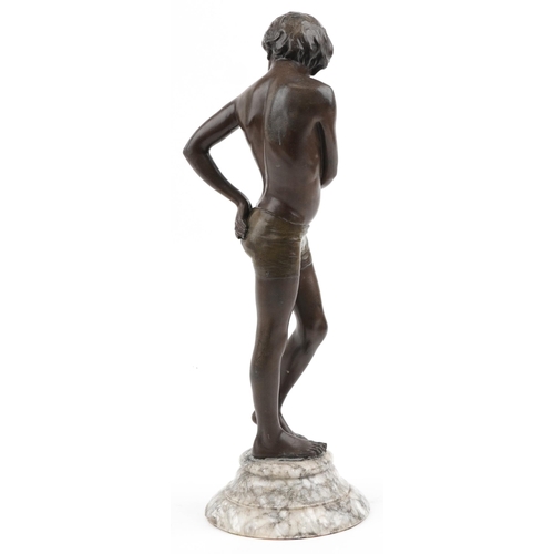 390 - 19th century patinated spelter figure of a semi nude boy raised on a circular marble base