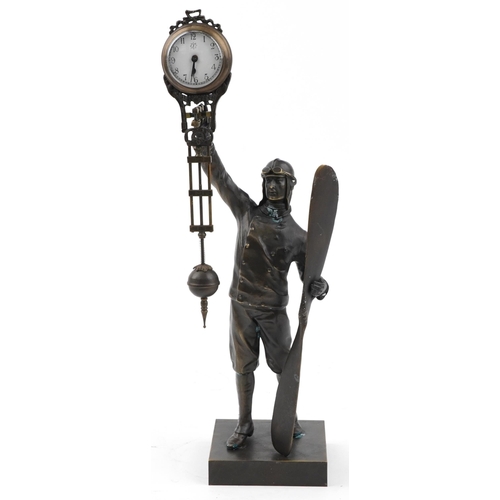 504 - Patinated bronze military interest mystery clock in the form of a pilot, 37cm high