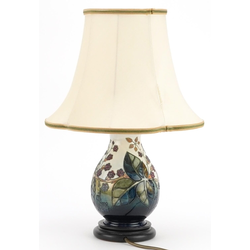 398 - Moorcroft pottery baluster vase table lamp decorated with flowers, 44cm high