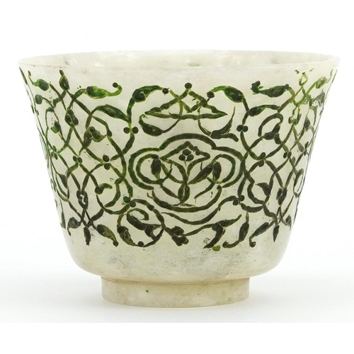 432 - Islamic Ottoman jade cup engraved with stylised foliage, 5cm in diameter