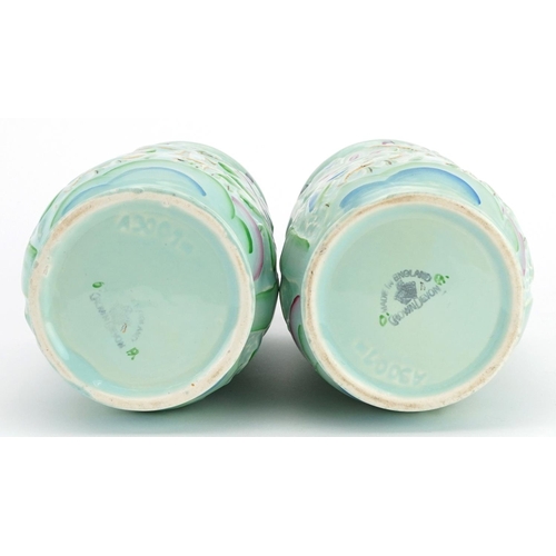 409 - Crown Devon, pair of Art Deco vases hand painted and decorated in low relief with leaping deer among... 