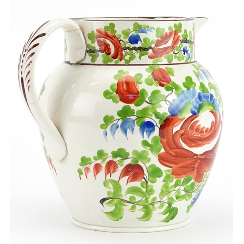 261 - Large early 19th century creamware jug hand painted with flowers, 19.5cm in length