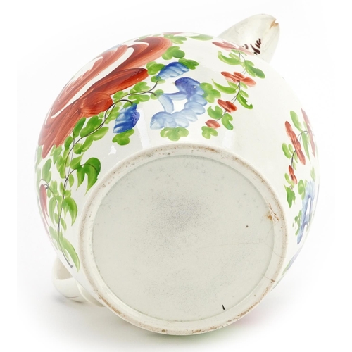 261 - Large early 19th century creamware jug hand painted with flowers, 19.5cm in length