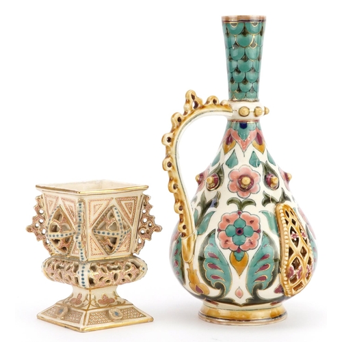 298 - Zsolnay Pecs, Hungarian reticulated handled vessel and reticulated vase, each hand painted with styl... 