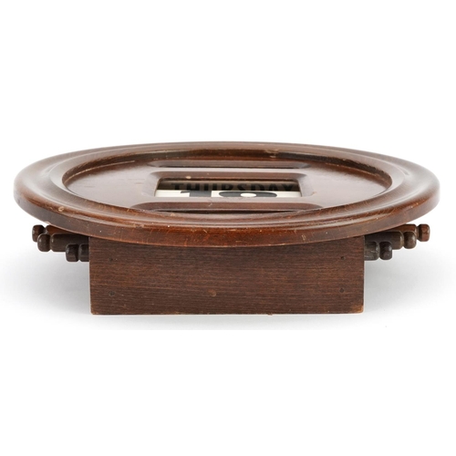 340 - Edwardian circular oak wall perpetual roller calendar, 30cm in diameter