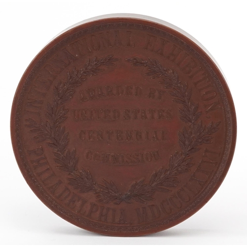 808 - Philadelphia International Exhibition bronze medallion and an ebonised card viewer with five photogr... 