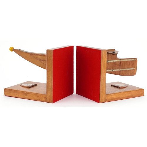 850 - Pair of rowing interest hardwood bookends with coat of arms, the largest 27cm wide
