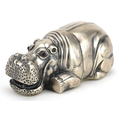 476 - Silver recumbent hippopotamus with ruby eyes, impressed Russian marks to the base, 7.5cm in length, ... 