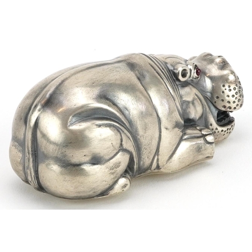 476 - Silver recumbent hippopotamus with ruby eyes, impressed Russian marks to the base, 7.5cm in length, ... 