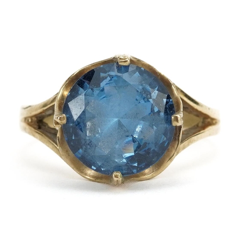 3223 - 9ct gold blue stone solitaire ring, the blue stone approximately 10.0mm in diameter, size O, 4.0g