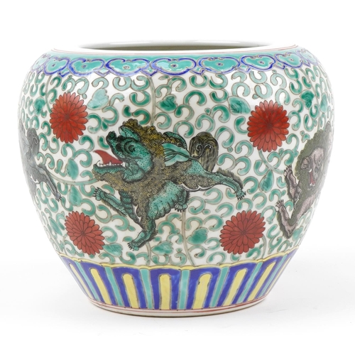 213 - Chinese porcelain jardiniere hand painted in the famille rose palette with mythical animals amongst ... 