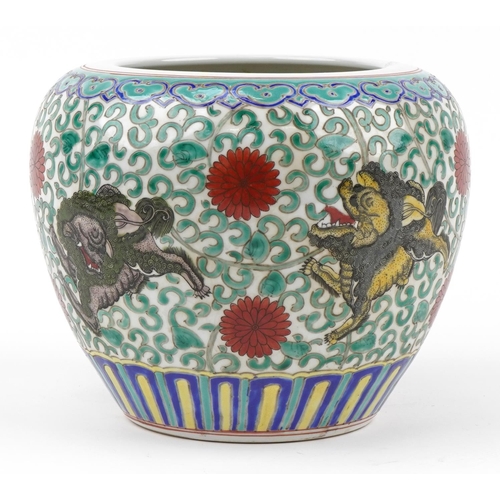 213 - Chinese porcelain jardiniere hand painted in the famille rose palette with mythical animals amongst ... 