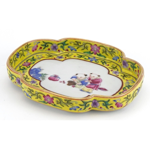 497 - Chinese porcelain four footed dish with yellow ground border hand painted in the famille rose palett... 