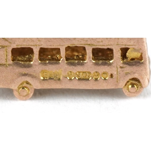 3216 - Three 9ct gold charms comprising vintage dial telephone, gondola and bus, the largest 2.2cm wide, to... 