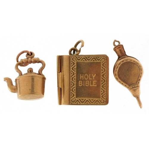 3227 - Three 9ct gold charms comprising opening holy bible, kettle and fire bellows, the largest 1.4cm in l... 