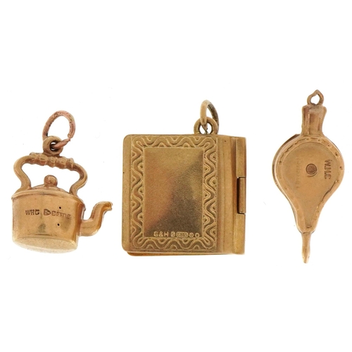 3227 - Three 9ct gold charms comprising opening holy bible, kettle and fire bellows, the largest 1.4cm in l... 