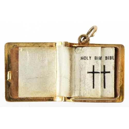 3227 - Three 9ct gold charms comprising opening holy bible, kettle and fire bellows, the largest 1.4cm in l... 