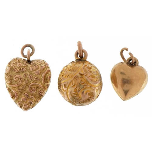 3221 - Three 9ct gold charms comprising embossed sphere, embossed love heart and one other love heart, the ... 