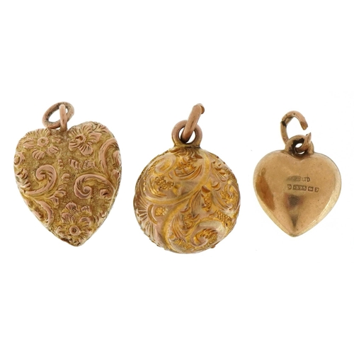 3221 - Three 9ct gold charms comprising embossed sphere, embossed love heart and one other love heart, the ... 