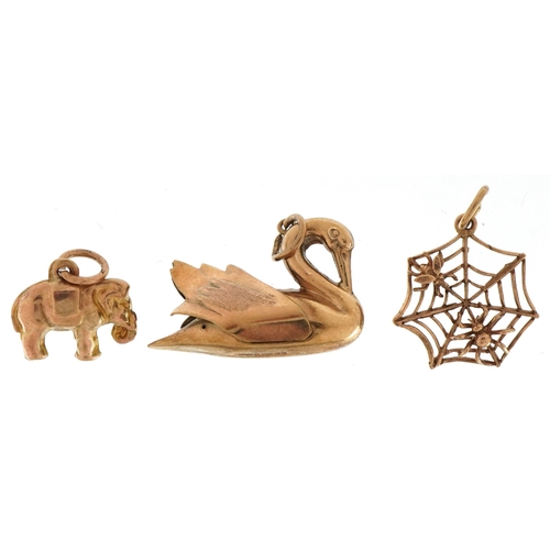 3208 - Three 9ct gold animal charms comprising swan, elephant and spider & fly in a web, the largest 2.4cm ... 