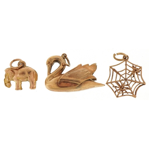 3208 - Three 9ct gold animal charms comprising swan, elephant and spider & fly in a web, the largest 2.4cm ... 