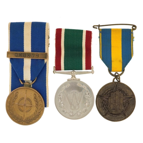 1223 - Three military interest medals including a Women's Voluntary Service medal with box