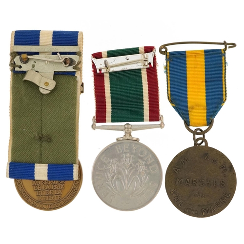 1223 - Three military interest medals including a Women's Voluntary Service medal with box