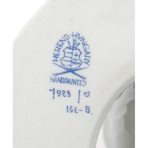 635 - Herend, pair of Hungarian floral encrusted porcelain candlesticks, each 13.5cm in diameter