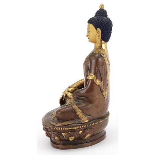 313 - Chino Tibetan partially gilt bronze figure of seated Buddha, 20cm high