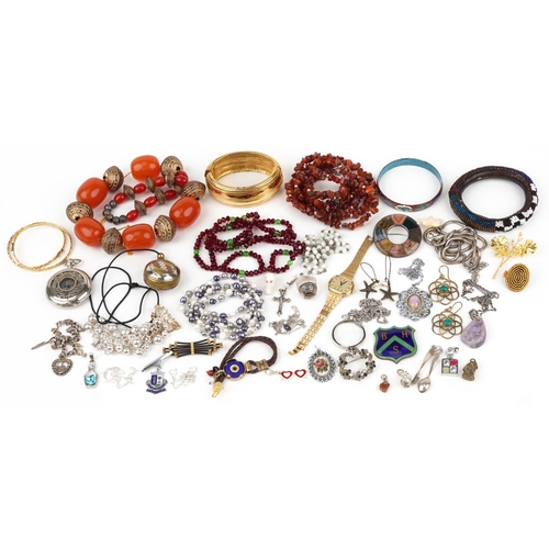 3806 - Vintage and later jewellery, some silver, including a silver Scottish hardstone brooch, large amber ... 