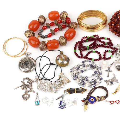 3806 - Vintage and later jewellery, some silver, including a silver Scottish hardstone brooch, large amber ... 