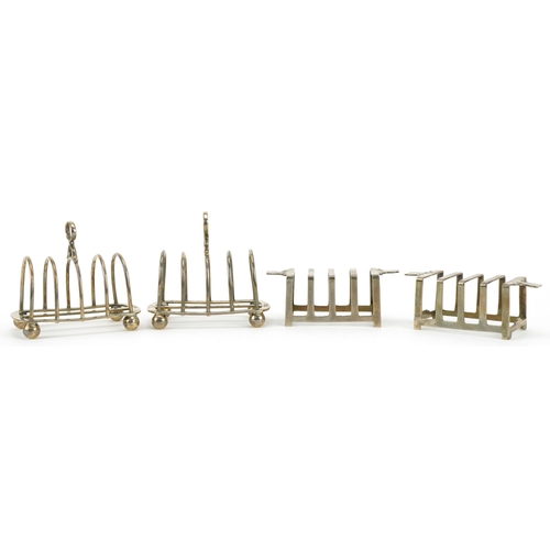 138 - Two pairs of silver four slice toast racks including an Art Deco pair by Mappin & Webb, the largest ... 