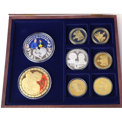 673 - Collection of predominantly gold plated commemorative coins including examples commemorating World W... 