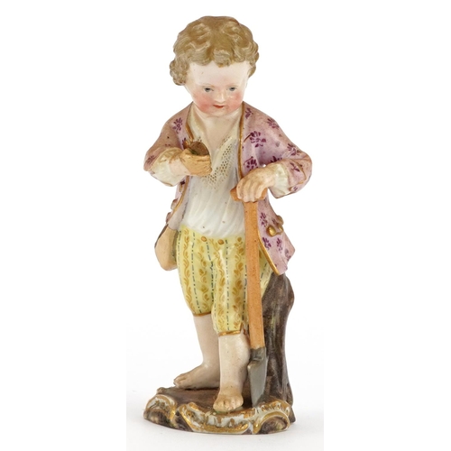 63 - Meissen, 19th century German porcelain figure of a young boy with spade, blue crossed sword marks an... 