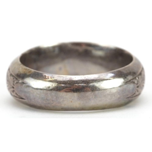 361 - Unmarked silver napkin ring embossed with foliage, 5cm in diameter, 18.6g