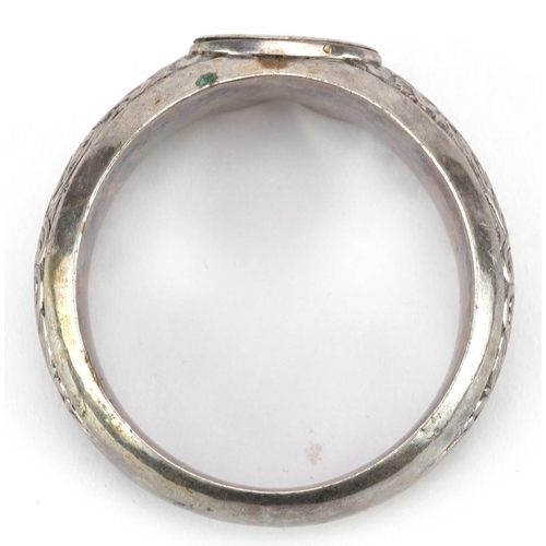 361 - Unmarked silver napkin ring embossed with foliage, 5cm in diameter, 18.6g