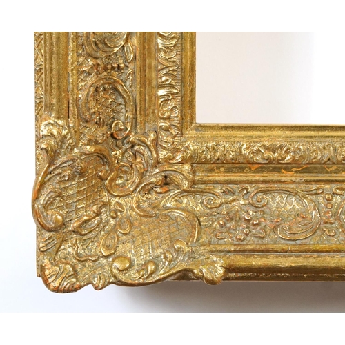 148A - Two ornate gilt picture frames including an oval example, the largest 100cm x 80cm