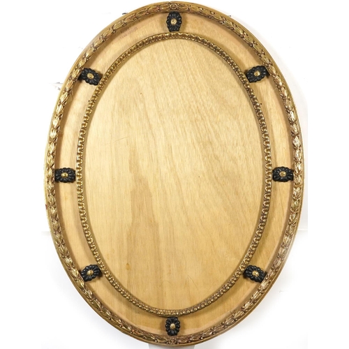 148A - Two ornate gilt picture frames including an oval example, the largest 100cm x 80cm