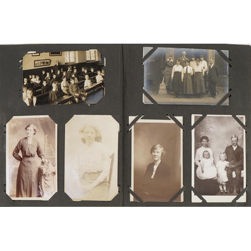 777 - Topographical and social history postcards arranged in an album including street scenes and portrait... 