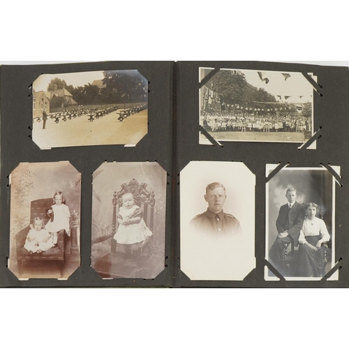 777 - Topographical and social history postcards arranged in an album including street scenes and portrait... 