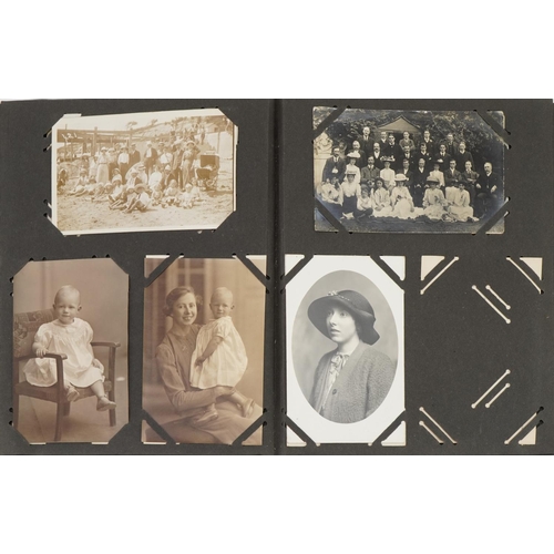 777 - Topographical and social history postcards arranged in an album including street scenes and portrait... 