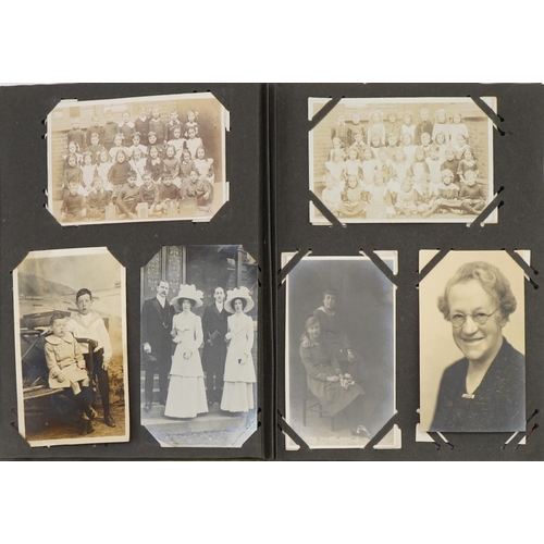 777 - Topographical and social history postcards arranged in an album including street scenes and portrait... 