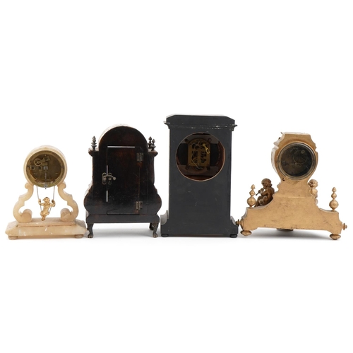 1896 - Three 19th century mantle clocks and an ornate case, the clocks comprising a gilt metal example surm... 