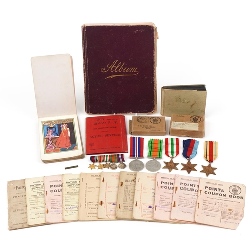 1219 - British military World War II medal group relating to the Davis family including medals with boxes o... 