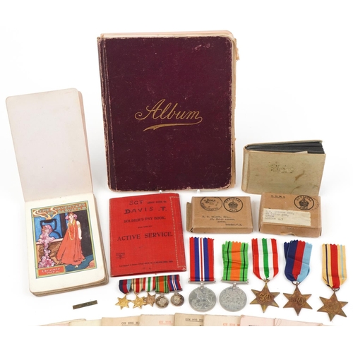 1219 - British military World War II medal group relating to the Davis family including medals with boxes o... 